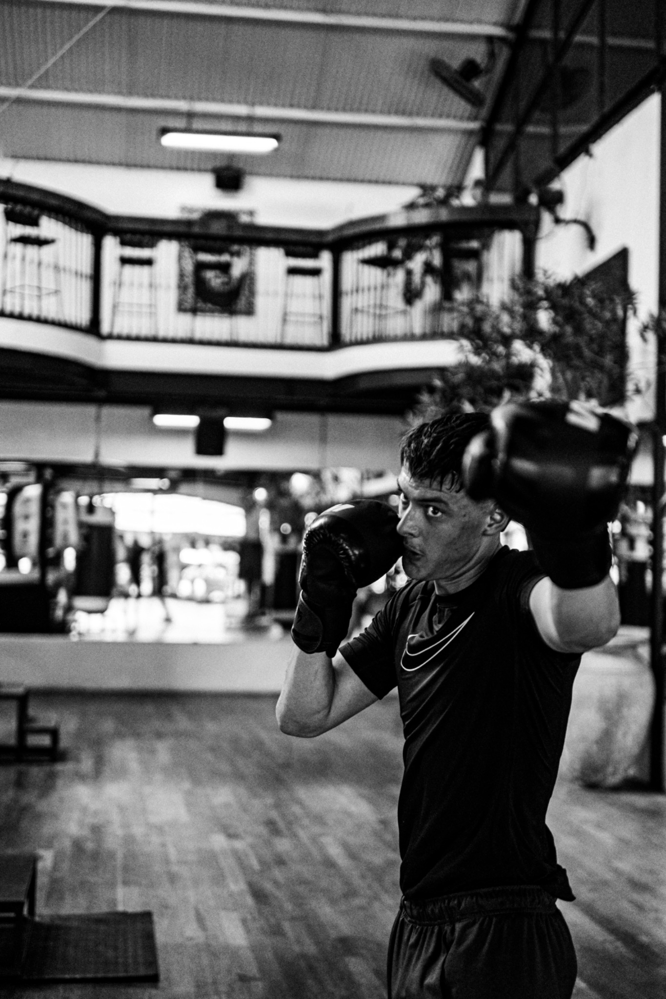 Black-and-white action photograph of Andri Casutt training in the gym.