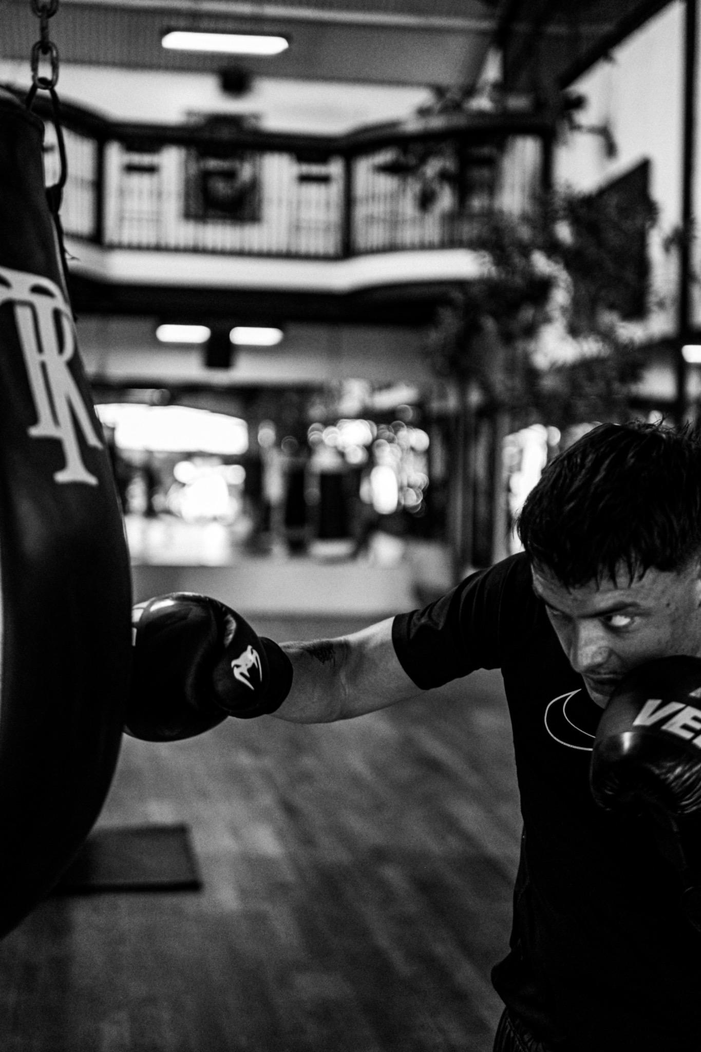 Close black-and-white boxing detail during training.